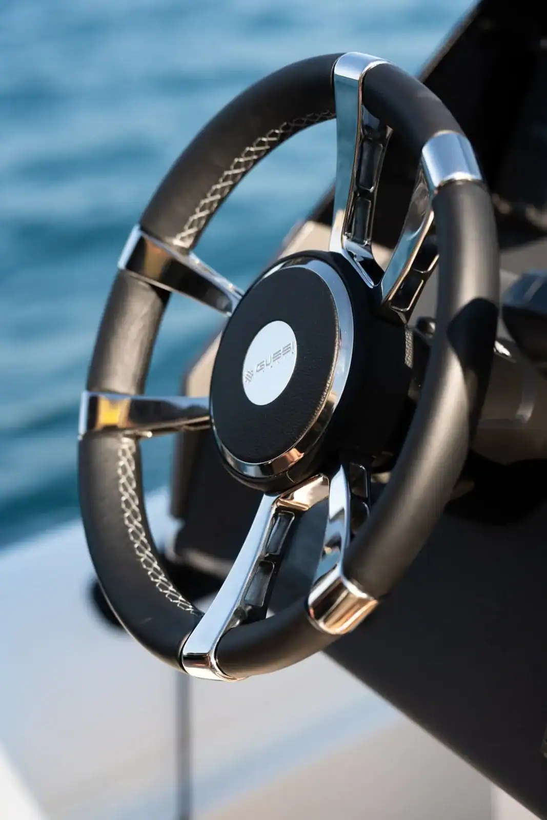 The steering wheel of the Technohull GT7 in carbon and chrome with a Technohull centre boss